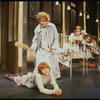 Mary K. Lombardi as Annie and Ruth Kobart as Miss Hannigan w. orphans in a scene from the Chicago production of the musical "Annie."