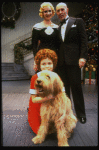 Mary K. Lombardi as Annie, Norwood Smith as Daddy Warbucks, Ellen Martin as Grace and Sandy in a scene from the Chicago production of the musical "Annie."