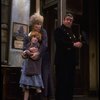 Allison Smith as Annie and Alice Ghostley as Miss Hannigan w. a policeman in a scene from the Broadway production of the musical "Annie."