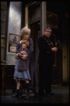Allison Smith as Annie and Alice Ghostley as Miss Hannigan w. a policeman in a scene from the Broadway production of the musical "Annie."