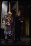 Allison Smith as Annie and Alice Ghostley as Miss Hannigan w. a policeman in a scene from the Broadway production of the musical "Annie."