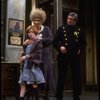Allison Smith as Annie and Alice Ghostley as Miss Hannigan w. a policeman in a scene from the Broadway production of the musical "Annie."