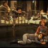 Allison Smith as Annie (L) w. orphans in a scene from the Broadway production of the musical "Annie."