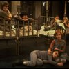Allison Smith as Annie (L) w. orphans in a scene from the Broadway production of the musical "Annie."