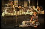 Allison Smith as Annie (R) w. orphans in a scene from the Broadway production of the musical "Annie."