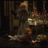 Alice Ghostley as Miss Hannigan and Allison Smith as Annie w. orphans in a scene from the Broadway production of the musical "Annie."