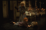 Alice Ghostley as Miss Hannigan and Allison Smith as Annie w. orphans in a scene from the Broadway production of the musical "Annie."