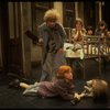 Alice Ghostley as Miss Hannigan and Allison Smith as Annie w. orphans in a scene from the Broadway production of the musical "Annie."