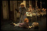 Alice Ghostley as Miss Hannigan and Allison Smith as Annie w. orphans in a scene from the Broadway production of the musical "Annie."