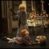 Alice Ghostley as Miss Hannigan and Allison Smith as Annie w. orphans in a scene from the Broadway production of the musical "Annie."