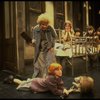 Alice Ghostley as Miss Hannigan and Allison Smith as Annie w. orphans in a scene from the Broadway production of the musical "Annie."