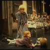 Alice Ghostley as Miss Hannigan and Allison Smith as Annie w. orphans in a scene from the Broadway production of the musical "Annie."