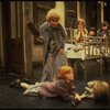 Alice Ghostley as Miss Hannigan and Allison Smith as Annie w. orphans in a scene from the Broadway production of the musical "Annie."