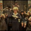 Alice Ghostley as Miss Hannigan w. orphans in a scene from the Broadway production of the musical "Annie."