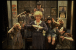 Alice Ghostley as Miss Hannigan w. orphans in a scene from the Broadway production of the musical "Annie."
