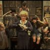 Alice Ghostley as Miss Hannigan w. orphans in a scene from the Broadway production of the musical "Annie."