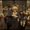 Alice Ghostley as Miss Hannigan w. orphans in a scene from the Broadway production of the musical "Annie."