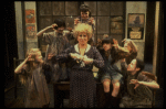 Alice Ghostley as Miss Hannigan w. orphans in a scene from the Broadway production of the musical "Annie."