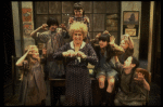 Alice Ghostley as Miss Hannigan w. orphans in a scene from the Broadway production of the musical "Annie."