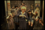 Alice Ghostley as Miss Hannigan w. orphans in a scene from the Broadway production of the musical "Annie."