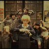 Alice Ghostley as Miss Hannigan w. orphans in a scene from the Broadway production of the musical "Annie."