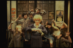 Alice Ghostley as Miss Hannigan w. orphans in a scene from the Broadway production of the musical "Annie."