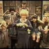 Alice Ghostley as Miss Hannigan w. orphans in a scene from the Broadway production of the musical "Annie."