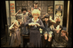 Alice Ghostley as Miss Hannigan w. orphans in a scene from the Broadway production of the musical "Annie."