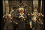Alice Ghostley as Miss Hannigan w. orphans in a scene from the Broadway production of the musical "Annie."