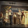 Allison Smith as Annie (C) w. Santa Claus and orphans in a scene from the Broadway production of the musical "Annie."