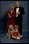 Betty Hutton as Miss Hannigan, Allison Smith as Annie, and John Schuck as Daddy Warbucks w. Sandy in a scene from the Broadway production of the musical "Annie."