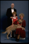 Betty Hutton as Miss Hannigan, Allison Smith as Annie, and John Schuck as Daddy Warbucks w. Sandy in a scene from the Broadway production of the musical "Annie."