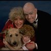 Betty Hutton as Miss Hannigan, Allison Smith as Annie, and John Schuck as Daddy Warbucks w. Sandy in a scene from the Broadway production of the musical "Annie."