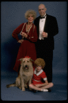 Betty Hutton as Miss Hannigan, Allison Smith as Annie, and John Schuck as Daddy Warbucks w. Sandy in a scene from the Broadway production of the musical "Annie."