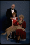 Betty Hutton as Miss Hannigan, Allison Smith as Annie, and John Schuck as Daddy Warbucks w. Sandy in a scene from the Broadway production of the musical "Annie."