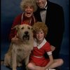 Betty Hutton as Miss Hannigan, Allison Smith as Annie, and John Schuck as Daddy Warbucks w. Sandy in a scene from the Broadway production of the musical "Annie."