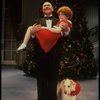 Kristi Coombs as Annie and Reid Shelton as Daddy Warbucks w. Sandy in a scene from the New Orleans production of the musical "Annie."