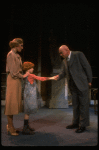 Kristi Coombs as Annie and Reid Shelton as Daddy Warbucks w. Grace in a scene from the New Orleans production of the musical "Annie."