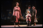 Kristi Coombs as Annie and Reid Shelton as Daddy Warbucks w. Grace in a scene from the New Orleans production of the musical "Annie."