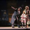 Kristi Coombs as Annie and Reid Shelton as Daddy Warbucks w. Grace in a scene from the New Orleans production of the musical "Annie."