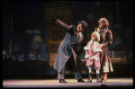 Kristi Coombs as Annie and Reid Shelton as Daddy Warbucks w. Grace in a scene from the New Orleans production of the musical "Annie."