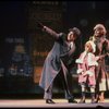 Kristi Coombs as Annie and Reid Shelton as Daddy Warbucks w. Grace in a scene from the New Orleans production of the musical "Annie."