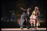 Kristi Coombs as Annie and Reid Shelton as Daddy Warbucks w. Grace in a scene from the New Orleans production of the musical "Annie."