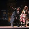 Kristi Coombs as Annie and Reid Shelton as Daddy Warbucks w. Grace in a scene from the New Orleans production of the musical "Annie."
