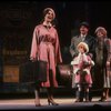Kristi Coombs as Annie and Reid Shelton as Daddy Warbucks w. Grace in a scene from the New Orleans production of the musical "Annie."