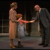 Kristi Coombs as Annie and Reid Shelton as Daddy Warbucks w. Grace in a scene from the New Orleans production of the musical "Annie."