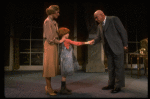 Kristi Coombs as Annie and Reid Shelton as Daddy Warbucks w. Grace in a scene from the New Orleans production of the musical "Annie."