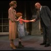 Kristi Coombs as Annie and Reid Shelton as Daddy Warbucks w. Grace in a scene from the New Orleans production of the musical "Annie."