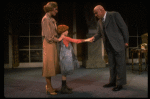 Kristi Coombs as Annie and Reid Shelton as Daddy Warbucks w. Grace in a scene from the New Orleans production of the musical "Annie."