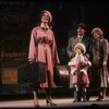 Kristi Coombs as Annie and Reid Shelton as Daddy Warbucks w. Grace in a scene from the New Orleans production of the musical "Annie."